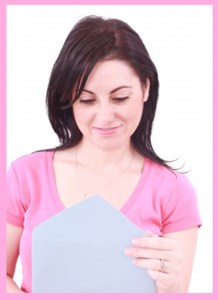 young woman opening a letter