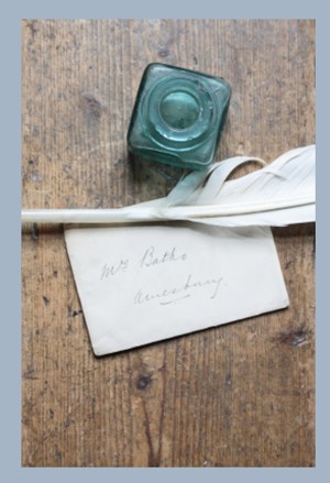 Ink well, quill pen and old letter