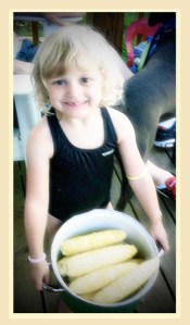 Little girl with a pan of corn #children #corn #summer #girls