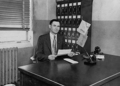 Frederick Helveston at his office desk. #Helvenston family #Frederick Helveston
